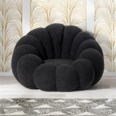 Sillón concha Basha de tela bouclé negra