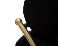 Banco de terciopelo negro y metal dorado