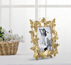 Marco de fotos de metal dorado con decoración de mariposas