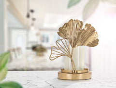 Porte-bougie en métal doré et verre avec design feuilles