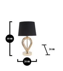 Lámpara de mesa de metal dorado con pantalla de tela negra