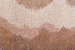 Mural abstracto en lienzo con marco de madera y colores cálidos