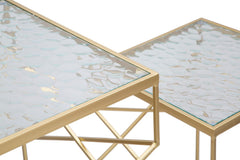 Mesa cuadrada de metal dorado con tablero de cristal