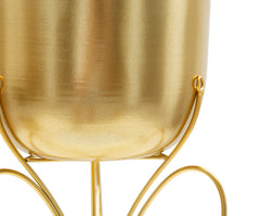 Soporte de jarrón de metal dorado con base en forma de mariposa