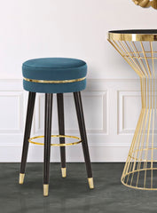 Taburete de bar terciopelo turquesa patas de madera y metal negras con acabado dorado
