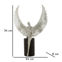 Estatuilla plateada con alas extendidas