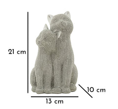 Estatua de pareja de gatos brillante