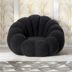 Sillón concha Basha de tela bouclé negra