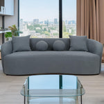 Sofá de 4 plazas Celin XL de tejido bouclé gris y diseño curvo