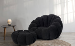 Sillón concha Basha de tela bouclé negra
