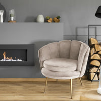 Sillón redondo de terciopelo topo con patas de metal dorado